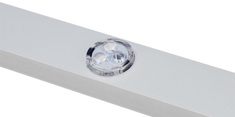 Close-up of a single clear LED dot seated flush in a white aluminum mounting channel